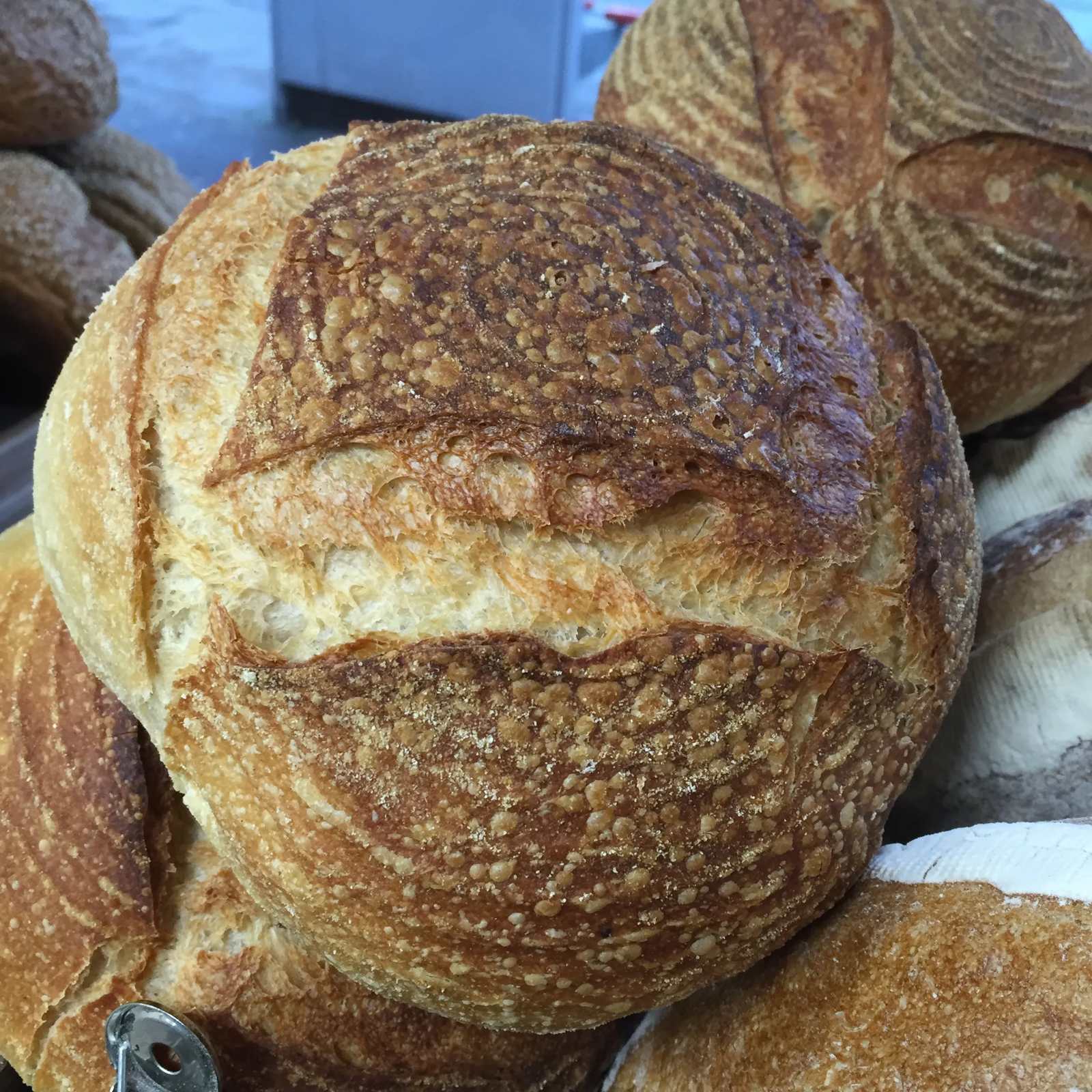 A pile of crusty sourdough loaves